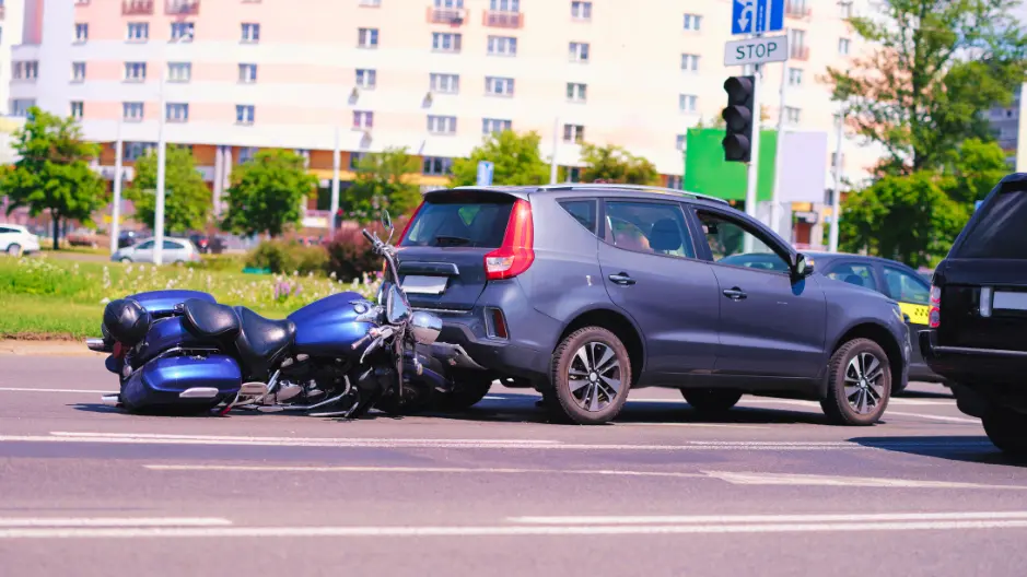 Image of a motorcycle crashed into the back of a car