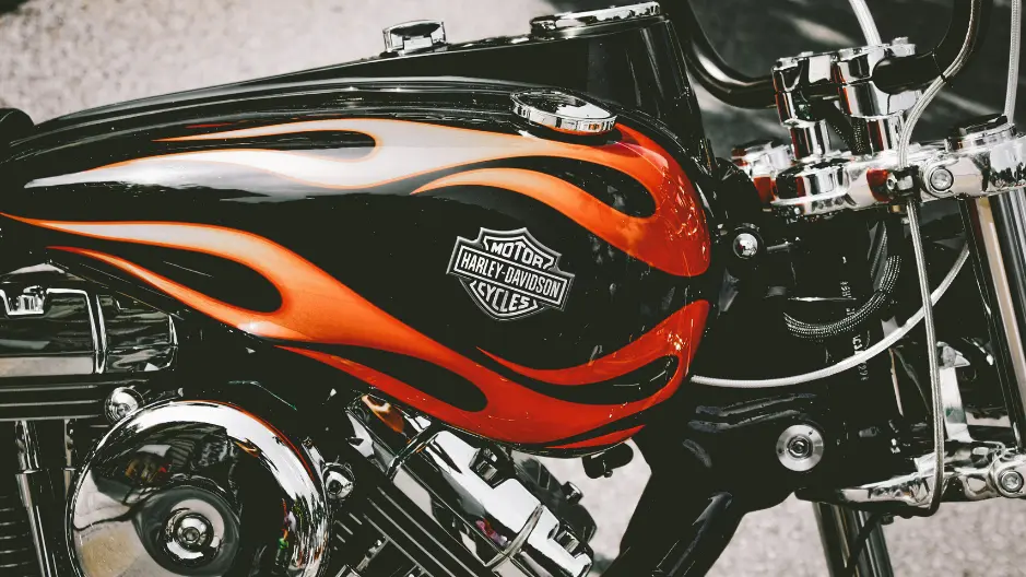 Close-up photo of a flame paint job on the gas tank of a Harley Davidson Motorcycle