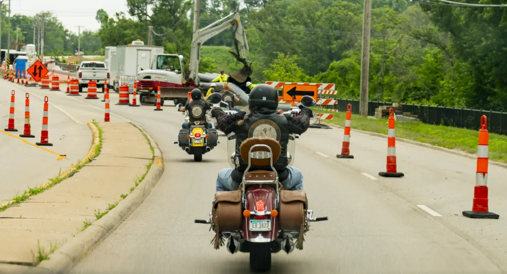 Image of The Biker Lawyers demonstrating how to ride defensively in a group, alert to changing road conditions and construction