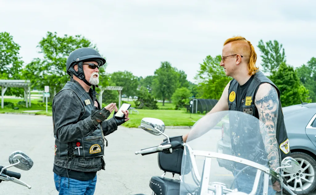 Image showing Biker Lawyer Dan Matzdorff consulting with a biker who witnessed a car accident