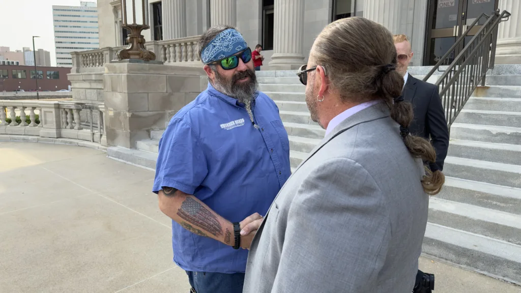 Image of a man meeting his lawyer preparing for trial