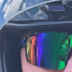 Extreme Close-up of a man wearing a motorcycle helmet and sunglasses