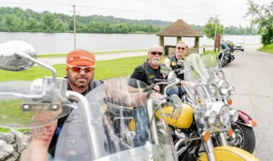 The Biker Lawyers, Motorcycle Accident Lawyers, sit on their motorcycles.