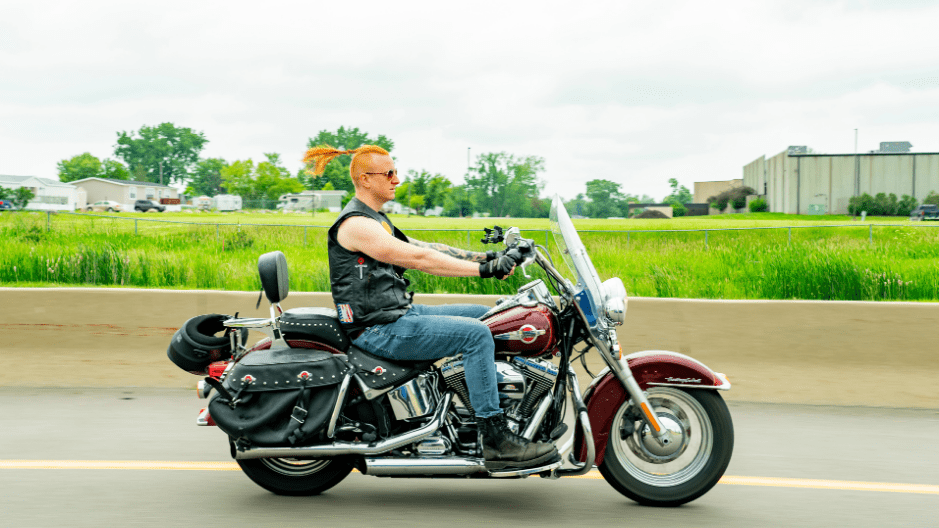 Personal Injury Lawyer Jonathan Jansen of The Biker Lawyers rides a motorcycle down a highway in Iowa