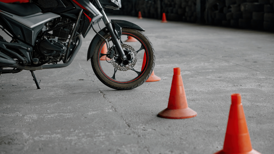 A motorcycle parked with the kickstand down illustrating proper parking techniques