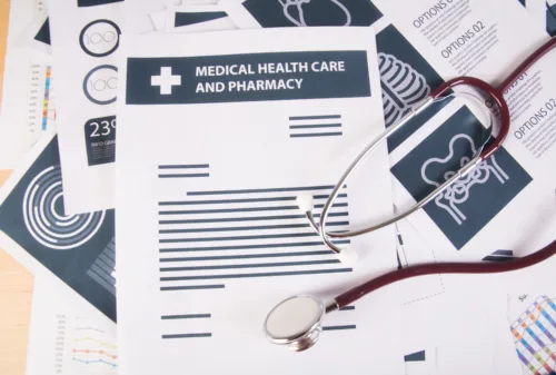Medical records report and stethoscope. 